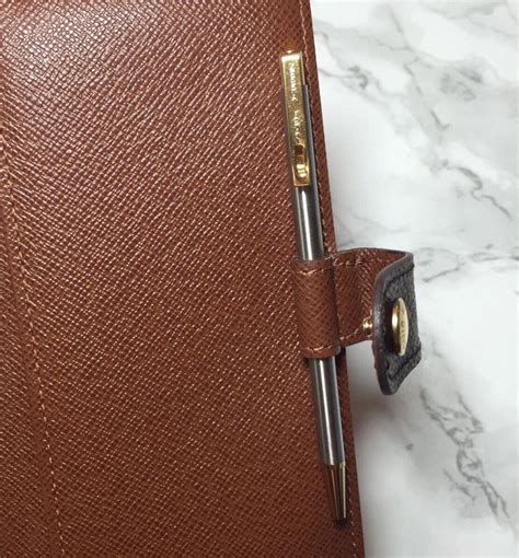 louis vuitton small agenda pen.